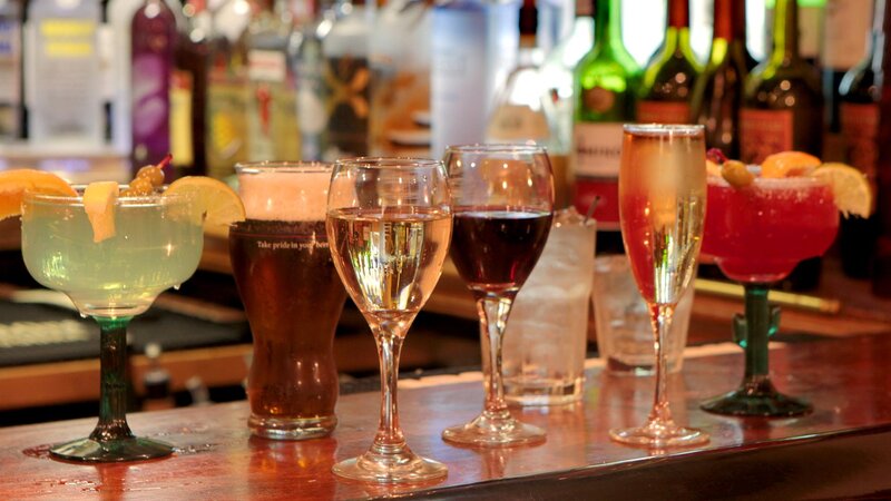 Multiple cocktails on bar counter