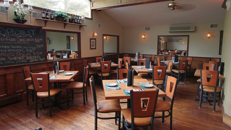 Rear dining room with many set tables